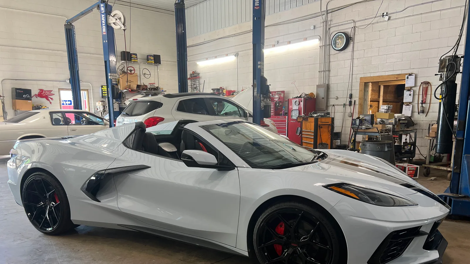A Corvette Stingray in for service in the bays at Super Tire and Muffler, auto repair and tires in Cortland, Ohio